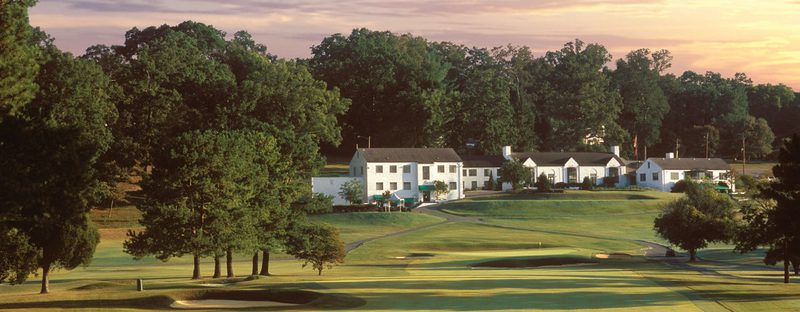 Holston Hills Country Club clubhouse above the golf course at sunset